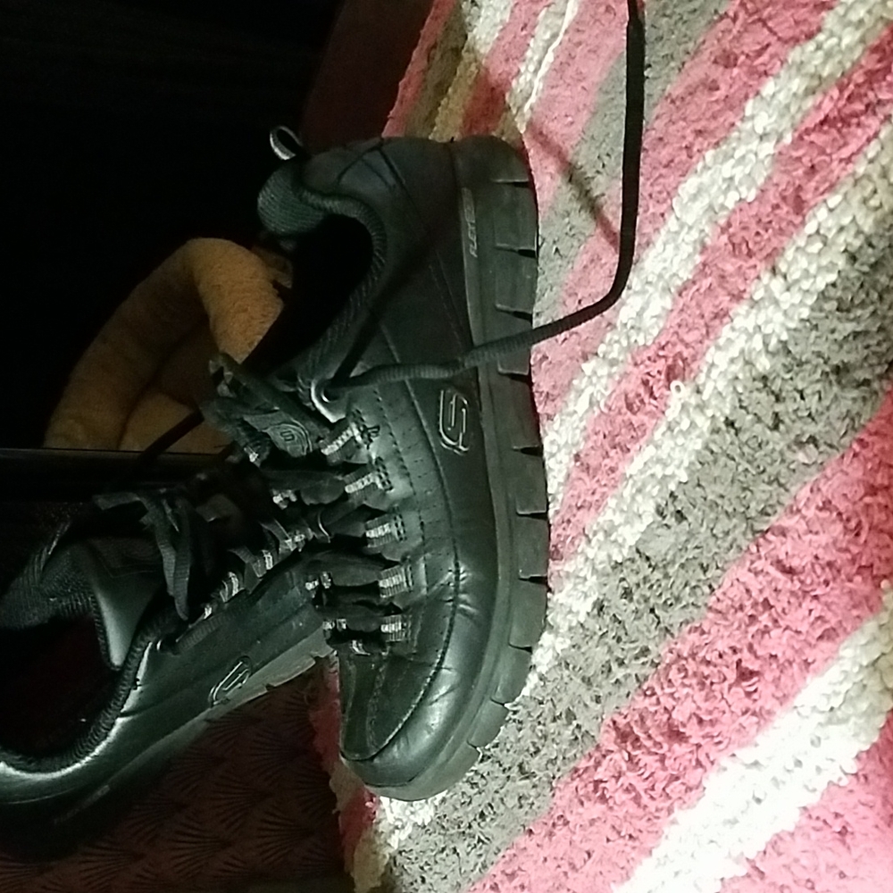 A pair of sketchers relaxed fit sneakers..